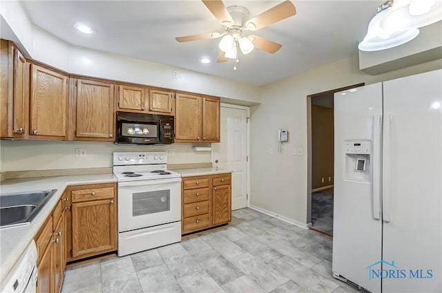 kitchen with ceiling fan, white appliances, and sink