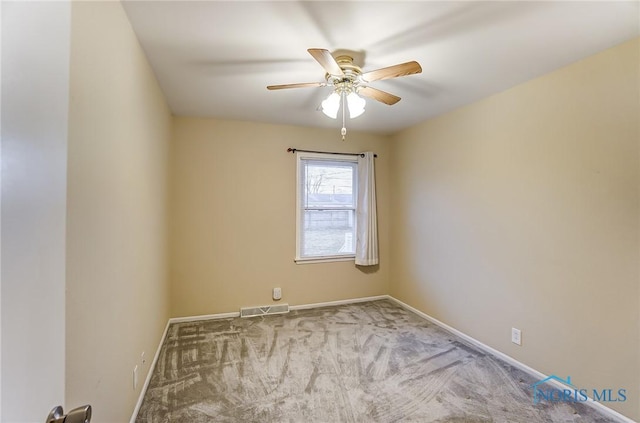 empty room featuring carpet floors and ceiling fan