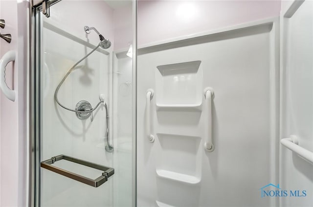 bathroom with an enclosed shower