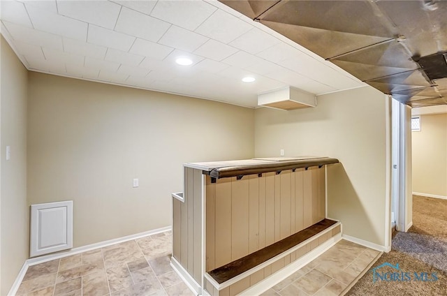 staircase featuring indoor bar