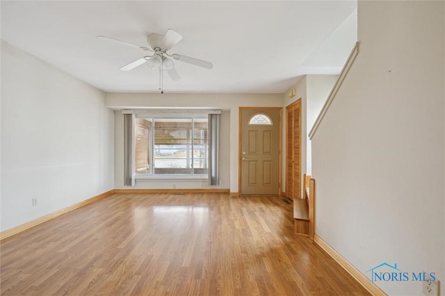 foyer featuring ceiling fan and light wood-type flooring