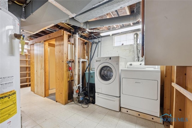 washroom featuring water heater and independent washer and dryer