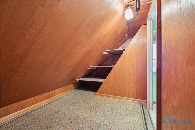 staircase with wooden walls