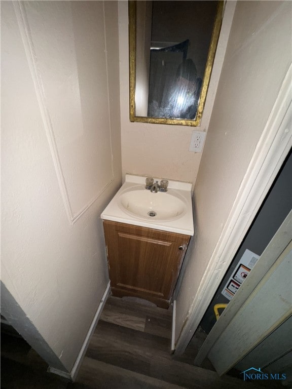 bathroom featuring vanity and wood-type flooring