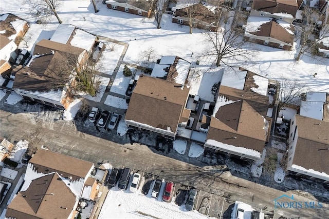 snowy aerial view with a residential view