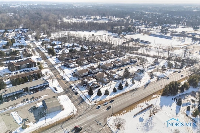 snowy aerial view featuring a residential view