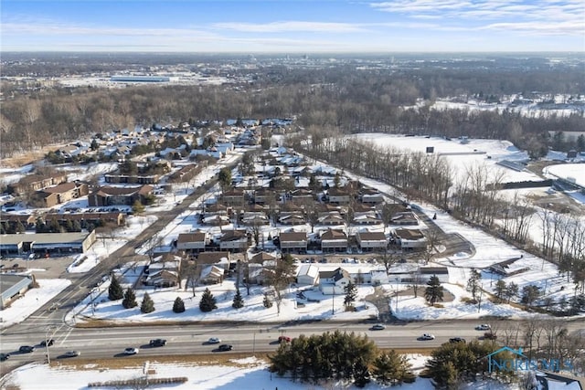 snowy aerial view featuring a residential view