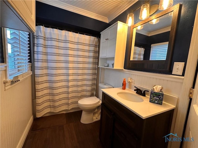 bathroom featuring crown molding, vanity, wood-type flooring, curtained shower, and toilet