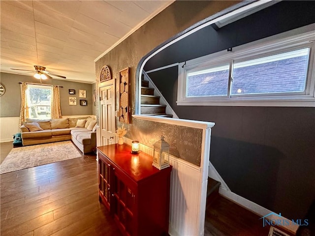 living room with hardwood / wood-style floors and ceiling fan