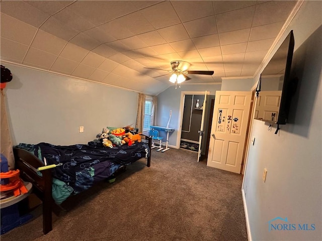 carpeted bedroom with vaulted ceiling, ornamental molding, and ceiling fan