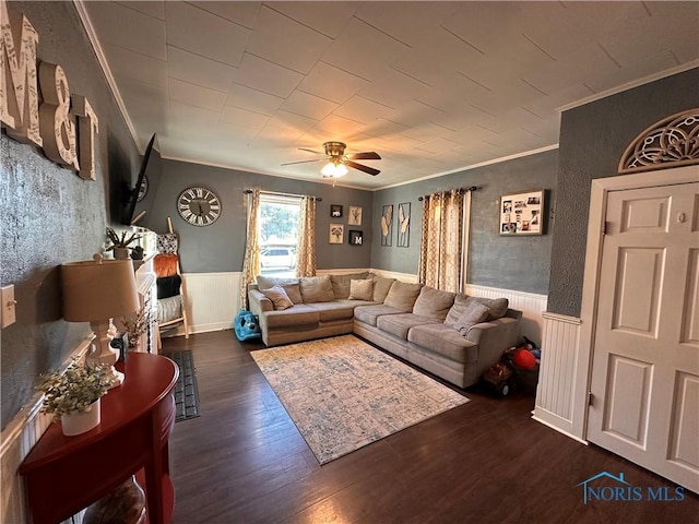 living room featuring ornamental molding, ceiling fan, and dark hardwood / wood-style flooring