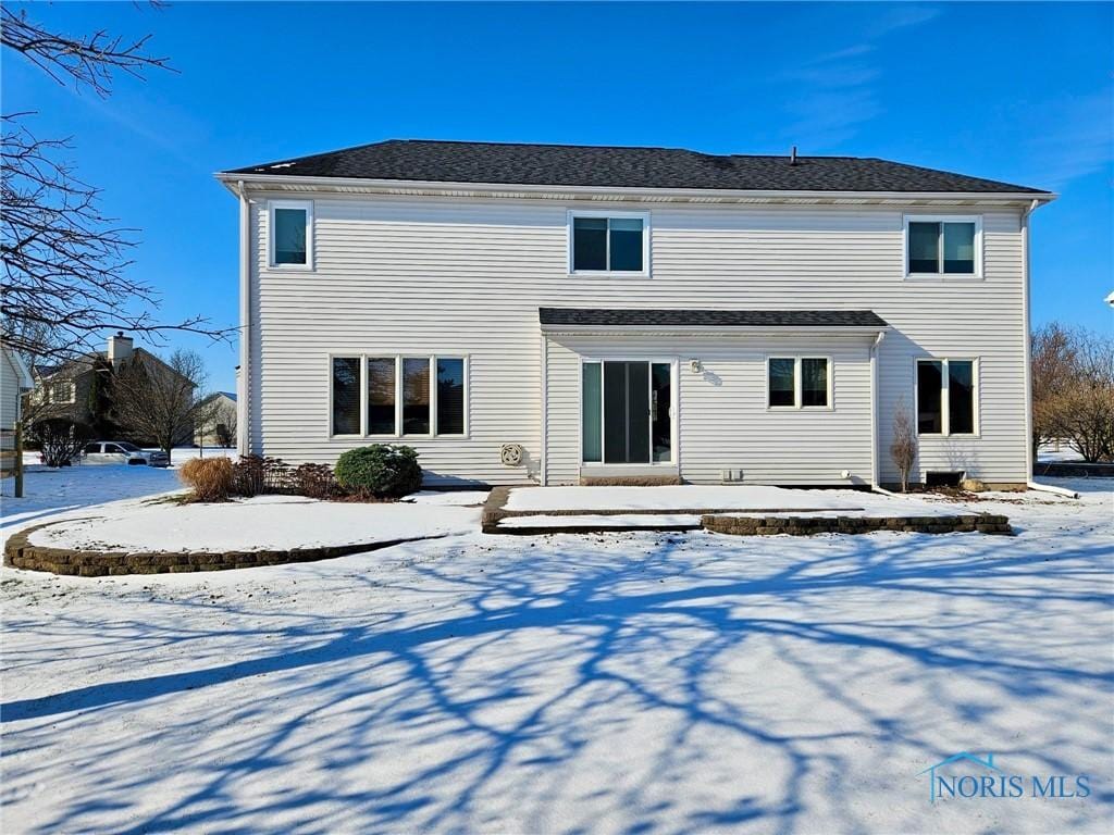 view of snow covered house