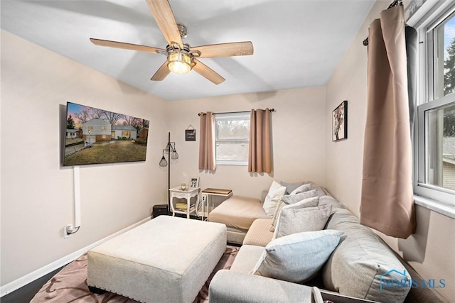 living room featuring ceiling fan