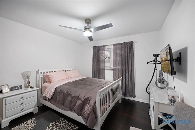 bedroom featuring dark hardwood / wood-style floors and ceiling fan