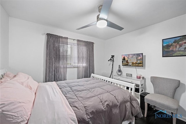 bedroom featuring hardwood / wood-style floors and ceiling fan