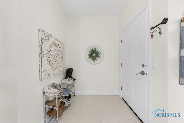 entrance foyer with light tile patterned floors