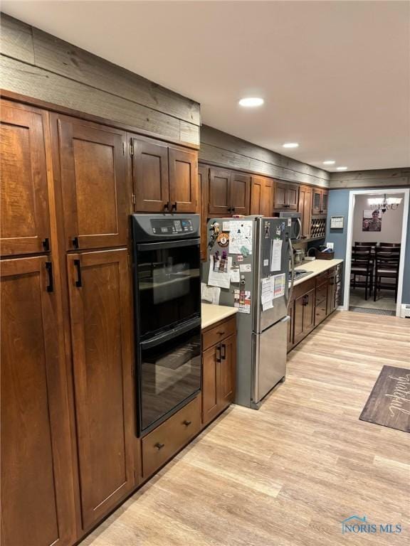 kitchen featuring appliances with stainless steel finishes and light wood-type flooring