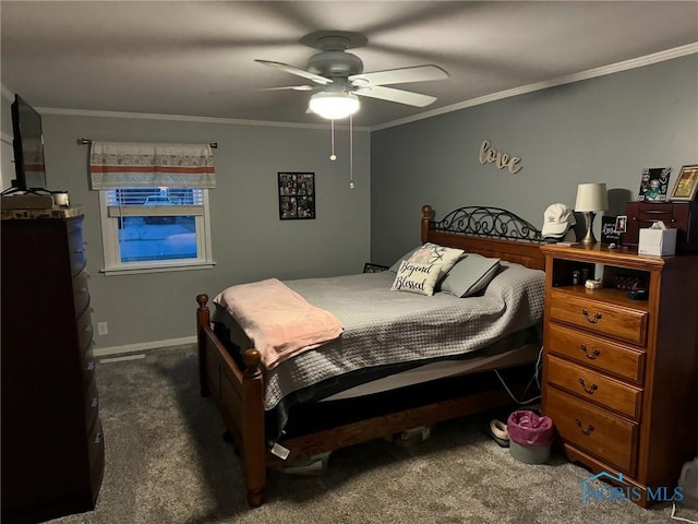 carpeted bedroom with crown molding and ceiling fan