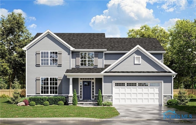 view of front of home with a garage and a front yard