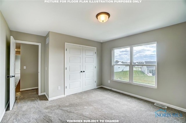 unfurnished bedroom with a closet and carpet flooring