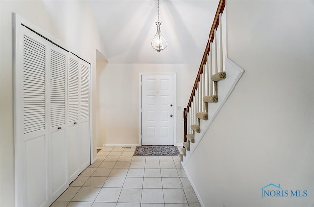 32 Abbey Rd, Perrysburg, OH 43551 - entryway with light tile patterned floors, baseboards, and stairs