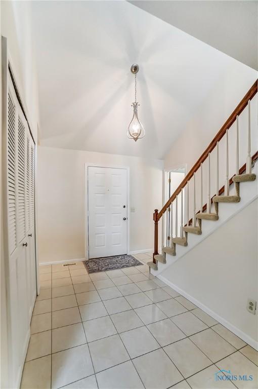 32 Abbey Rd, Perrysburg, OH 43551 - entryway featuring stairway, baseboards, and light tile patterned floors