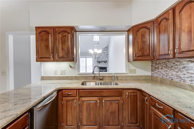 32 Abbey Rd, Perrysburg, OH 43551 - kitchen featuring light stone countertops, a notable chandelier, dishwasher, and a sink