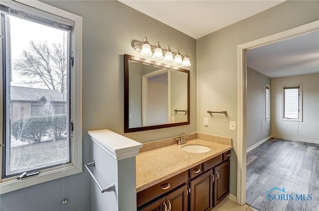 bathroom featuring vanity and wood-type flooring