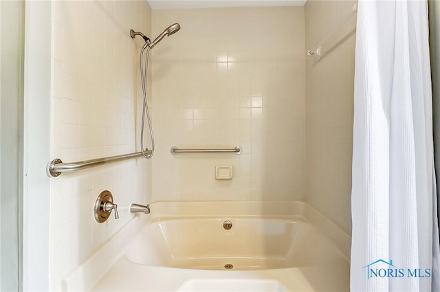 bathroom featuring shower / bath combination with curtain