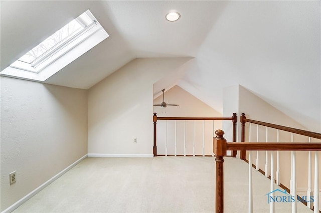 additional living space featuring lofted ceiling, ceiling fan, and carpet