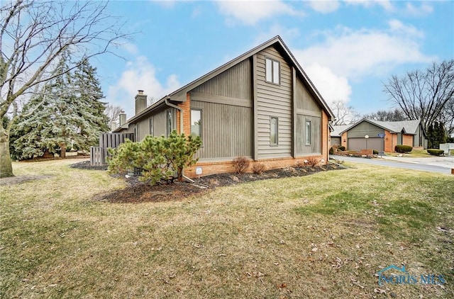 view of home's exterior with a garage and a lawn