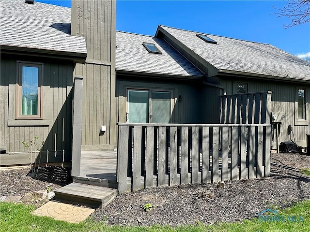 32 Abbey Rd, Perrysburg, OH 43551 - property entrance featuring a wooden deck, a chimney, and a shingled roof