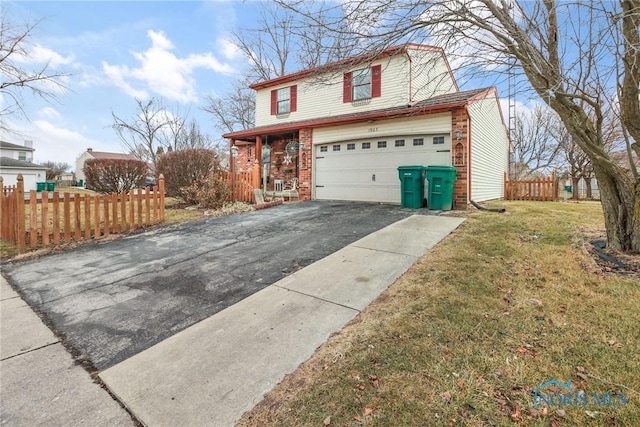 front facade with a garage and a front lawn