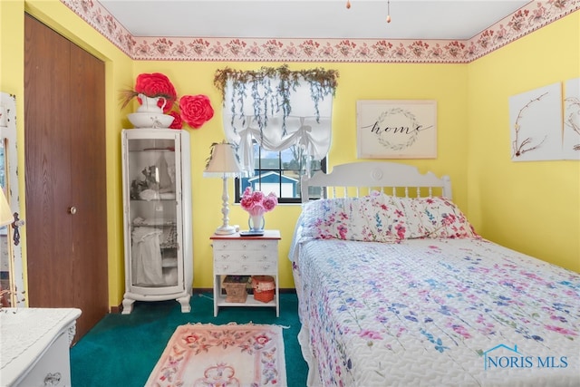 bedroom with dark colored carpet