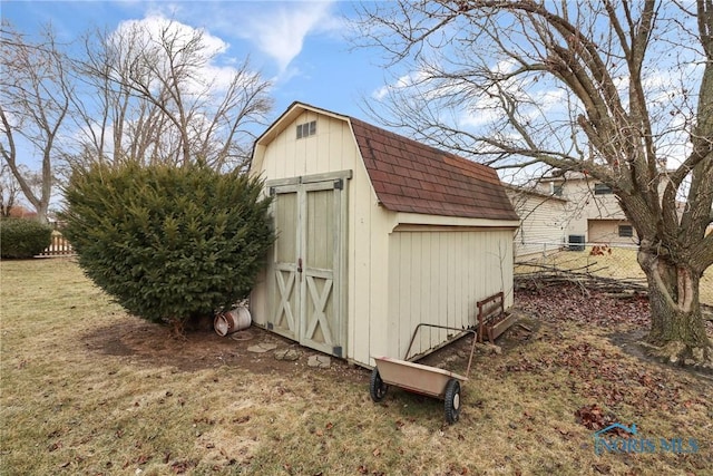 view of outdoor structure with a yard