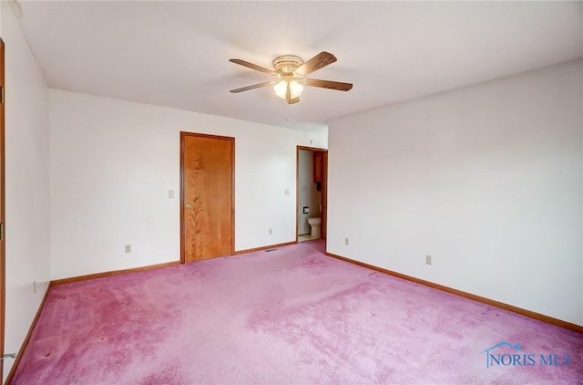 carpeted empty room featuring ceiling fan