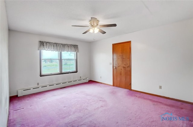 spare room featuring a baseboard radiator, carpet, and ceiling fan