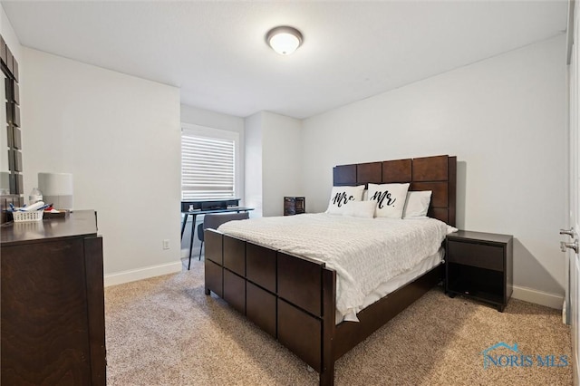 bedroom featuring light carpet