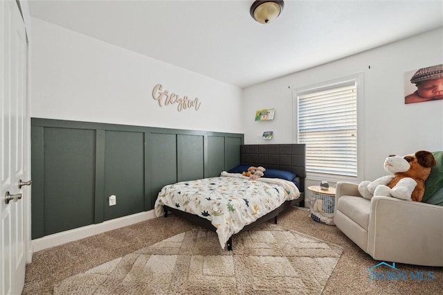 bedroom with light colored carpet