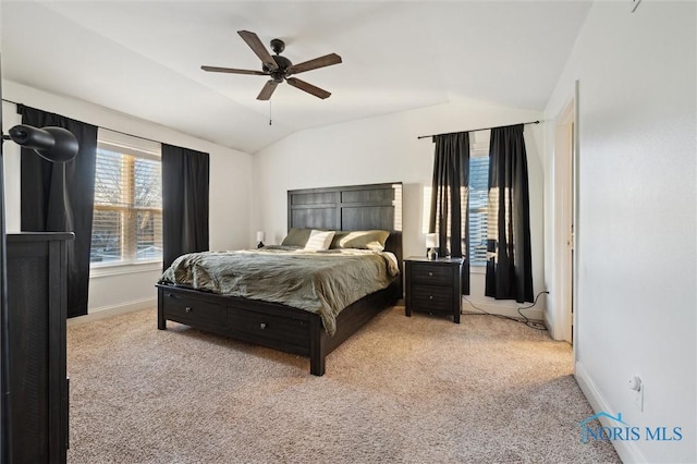 carpeted bedroom featuring ceiling fan and lofted ceiling