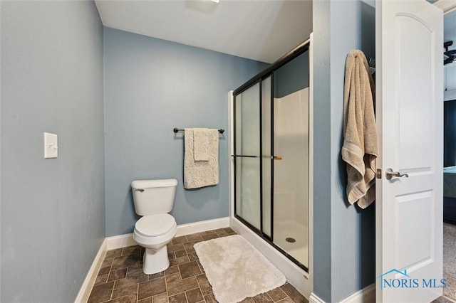 bathroom with toilet and walk in shower