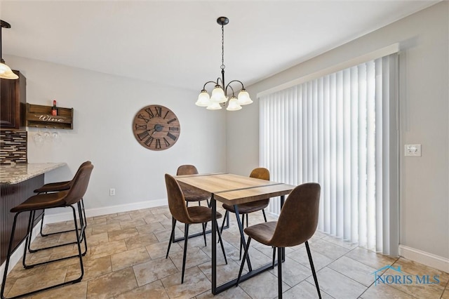 dining space with a chandelier