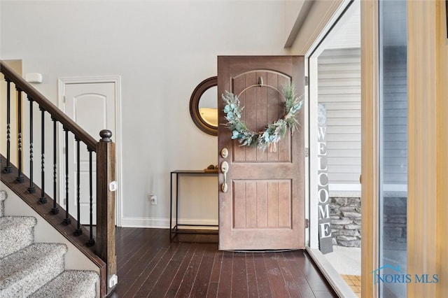 foyer with dark hardwood / wood-style floors