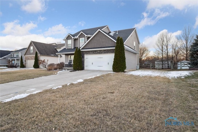 view of front of property with a garage and a front yard