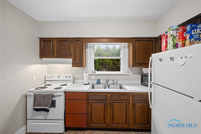 kitchen featuring sink and white appliances