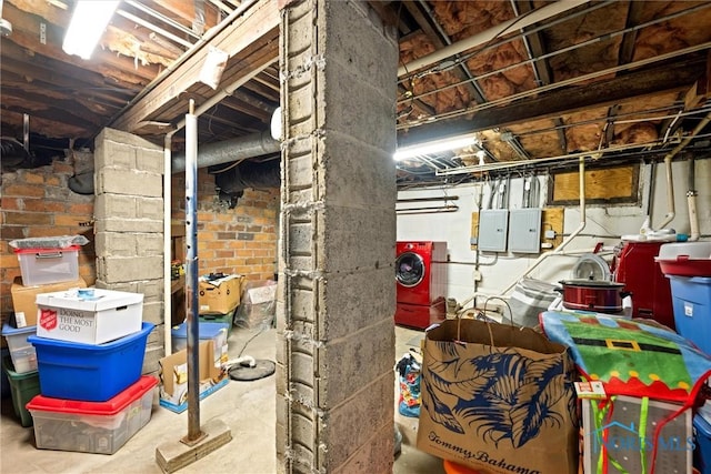 basement featuring washer / clothes dryer and electric panel