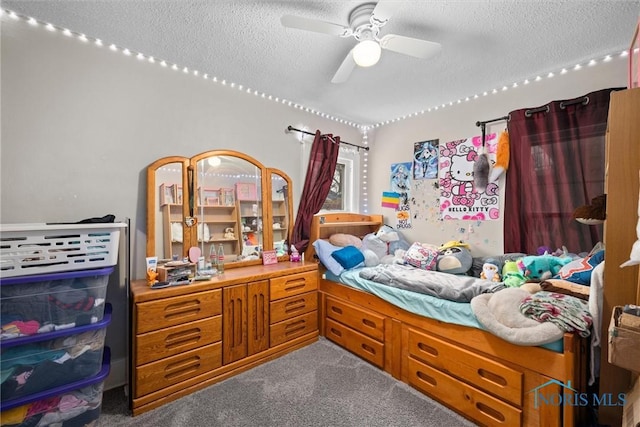 carpeted bedroom with ceiling fan and a textured ceiling