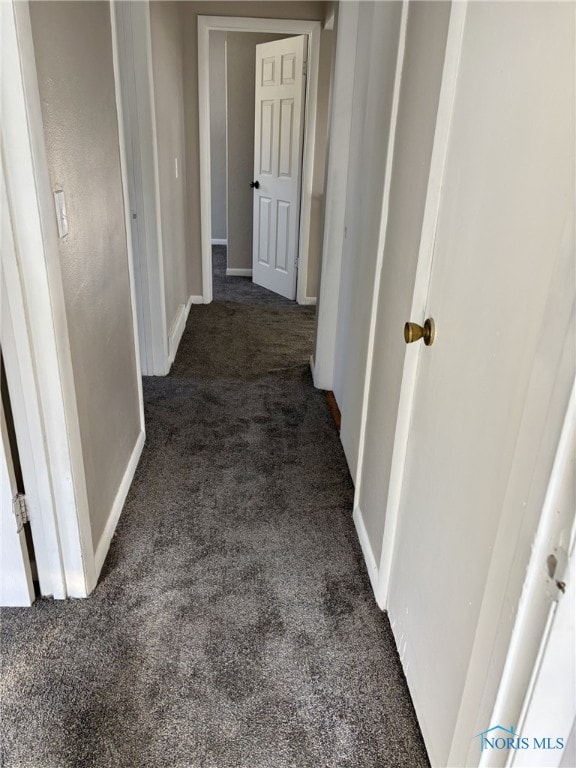 corridor with dark carpet