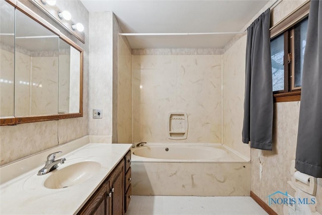 bathroom with vanity and bathtub / shower combination