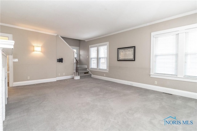 unfurnished living room featuring ornamental molding and light carpet